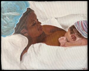 Mother lovingly holding her sleeping baby.